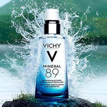 vichy product with water splashing in background