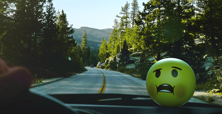 green ball with face in car