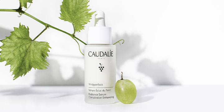 Caudalie product with grape vine in background