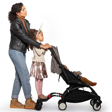 woman pushing kids in stroller