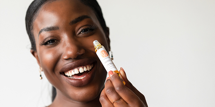 woman laughing and with Wildcraft product