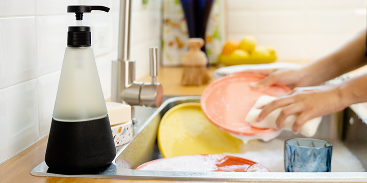 person doing dishes with Cleancult product